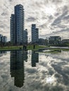 Library of trees, new Milan park. Solaria tower. Skyscrapers mirrored in the fountain. Italy Royalty Free Stock Photo