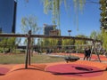 Library of Trees, relaxation area with benches and swings. Weeping willows. New park in the heart of Milan. Italy Royalty Free Stock Photo