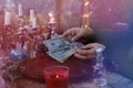 Librate with money, female hands of psychic doing witchcraft passes with dollars, esoteric Oracle performs ritual of removing