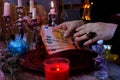 Librate with money, female hands of psychic doing witchcraft passes with euro banknotes, esoteric Oracle performs ritual of