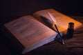 Libro antico con penna e calamaio Royalty Free Stock Photo