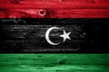 Libya flag on wooden planks background