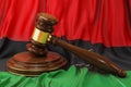 Libyan law and justice concept. Wooden gavel on flag of Libya, 3D rendering