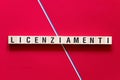 Licenziamenti - layoffs in Italian word concept on cubes