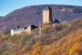 Lichtenberg castle on a hill surrounded by colorful trees