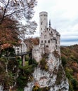 Lichtenstein Castle exterior in fall with dramatic cliffs.