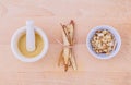 Licorice herbal medicine including powder, chopped and sliced root and mortar on wooden table