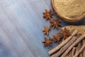 Licorice, licorice powder and star anise on the wooden background