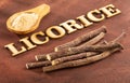 Licorice powder on the wooden table - Glycyrrhiza glabra