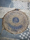 The lid of canal on the street of medieval town in the center of Catalonia, Spain