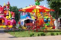 LIDA, BELARUS - JULY 10, 2021: Bright colorful children carousel in the amusement park in summer.