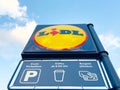 Lidl parking and coffee sign against blue sky Royalty Free Stock Photo
