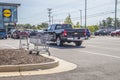 Lidl retail store shopping carts scattered around the parking lot Royalty Free Stock Photo