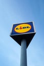 Lidl supermarket logo on tall pole outside a store in Bucharest, Romania on April 9, 2023