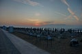 Lido di Jesolo beach view, equipped with umbrellas and sunbeds early morning at sunrise Royalty Free Stock Photo