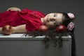 Lie down little girl with three pomegranates around of her hair happy yalda Iranian celebration theme