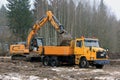 Liebherr Crawler Excavator Loads Sisu SR332 Tip Lorry