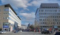 View over square on modern buildings against blue winter sky focus on building left Royalty Free Stock Photo