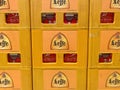 Closeup of beer crates with bottles with logo lettering of belgian abbey brewery leffe in supermarket