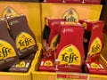 Closeup of beer crates with bottles with logo lettering of belgian abbey brewery leffe in supermarket