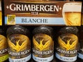 Closeup of six pack beer bottles with logo lettering of belgian grimbergen brewery Royalty Free Stock Photo