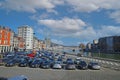 View over riverside parking lot on river meuse with bridge against blue sky