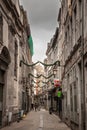 LIEGE, BELGIUM - NOVEMBER 9, 2022: Rue en neuvice, a pedestrian street of the city center of Liege, with facade of old buildings,