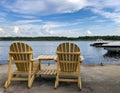 Lielupe river embankment in Jurmala with wooden sun loungers Royalty Free Stock Photo