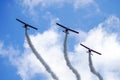 Liepaja, Latvia - August 7, 2022: Three red sports planes make a group flight during an air show