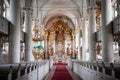 The aisle of a altar inside Liepaja Holy Trinity Cathedral with church pews Royalty Free Stock Photo