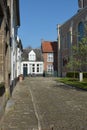 LIER, BELGIUM - APRIL 2016: typical beguine houses and cobblestone street