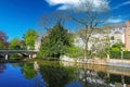 View over water town moat on bridge, romantic cityscape, green park, clear blue sky