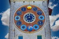 View on medieval tower with 12 clock faces showing metonic moon phases, time, periodic phenomena, solar cycle, tides, seasons Royalty Free Stock Photo
