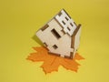 Lies an inverted house on a maple leaf