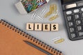 Lies - word concept from wooden blocks. Wooden cubes with letters. Top view