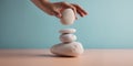 Life Balance Concept. Hand Setting White Natural Zen Stone Stack. Balancing Mind, Soul and Spirit. Mental Meditation