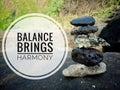 Life balance quote. Inspirational motivational quotes- Balance brings harmony. With sea stones balance formation on the big rock. Royalty Free Stock Photo