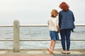 Life is beautiful when theres love in it. Rearview shot of a woman and her young daughter at the waterfront.