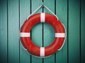 Life belt or rescue ring on wooden wall. Salvation, protection Royalty Free Stock Photo