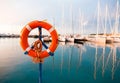 Life belt at a yacht harbor Royalty Free Stock Photo