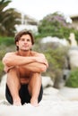 Life is better at the beach. a handsome young man enjoying a relaxing day at the beach. Royalty Free Stock Photo