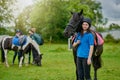 Life is better with a horse. young girls with their horses outdoors.