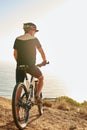 Life is better on a mountain bike. a man admiring the view from a hilltop while out on a bike ride. Royalty Free Stock Photo