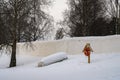 A Life boat and a Life Buoy by a Frozen River Royalty Free Stock Photo