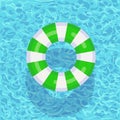 Life buoy floating in swimming pool. Beach rubber ring on water isolated on background. Lifebuoy, cute toy for children. Royalty Free Stock Photo