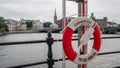 Life buoy hanging near river in the center of Stockholm,  Sweden, 10 august 2018 Royalty Free Stock Photo