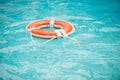 Life buoy. Lifebuoy in water. Life ring floating in a sea, life preserver. Rescue ring. Rescuering, Safety ring in blue Royalty Free Stock Photo