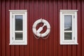 Life buoy on old red wood wall Royalty Free Stock Photo