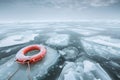 Life buoy rescue ring in the middle of the frozen iced ocean for rescue and help sos or climate change Royalty Free Stock Photo