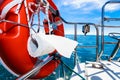 Life buoy with ropes and toilet paper on boat Royalty Free Stock Photo